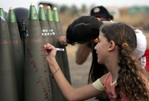 Israeli children signing rockets going into Gaza (c) PressTV